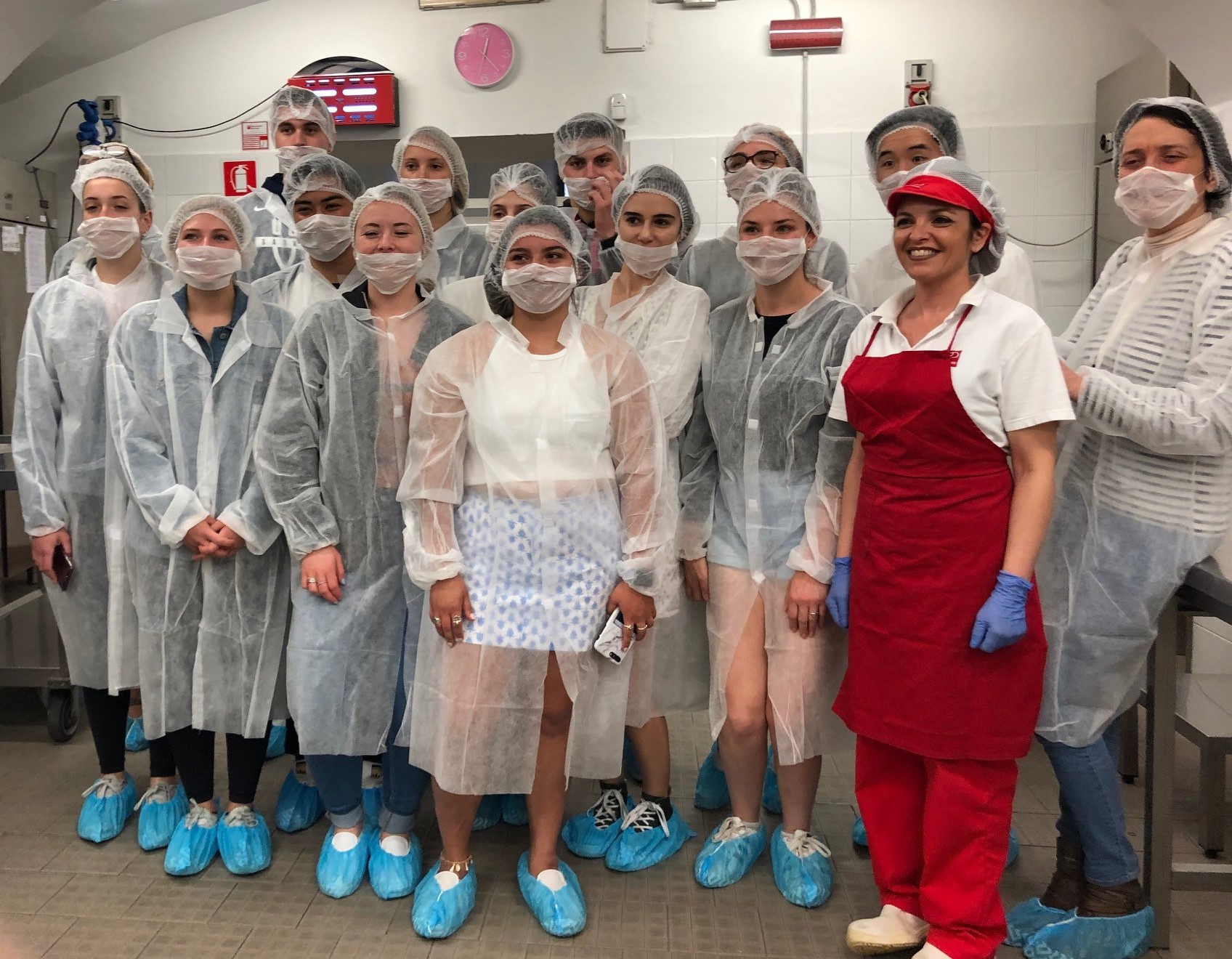 Photo of professional dietitians and UConn students in scrubs in a medical facility.