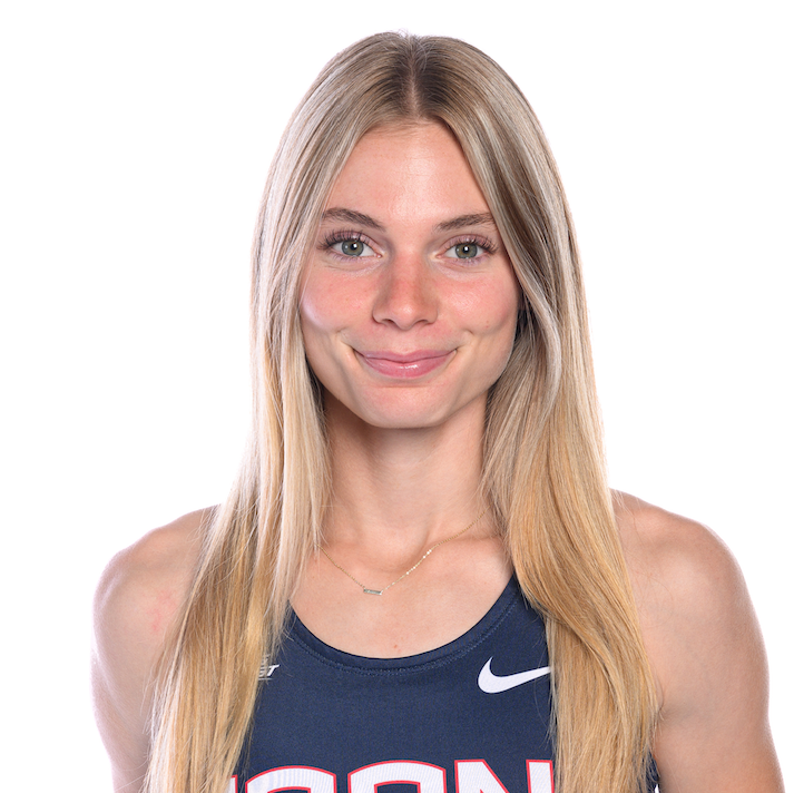 Headshot of a female student wearing a UConn track uniform with long blonde hair.